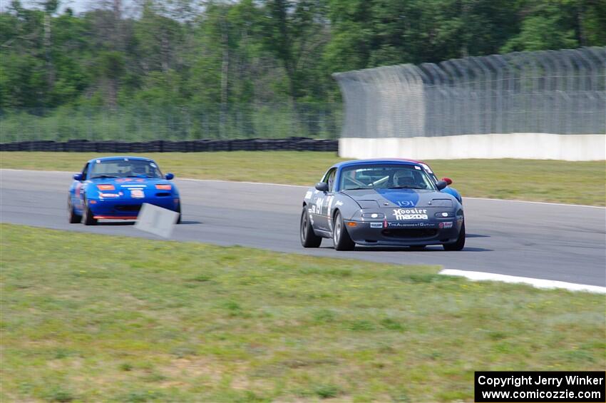 Aaron Jongbloedt's, Rick Buan's and Geoff Youngdahl's Mazda Miatas