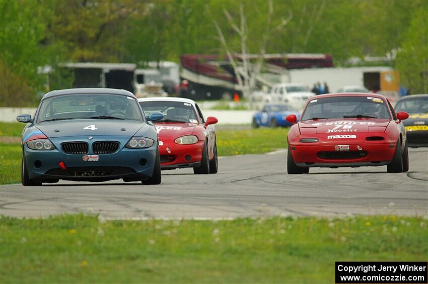 Roger Knuteson's T4 BMW Z4, Andrew Jenkins' Spec Miata Mazda Miata and Mitch Welker's Spec Miata Mazda Miata