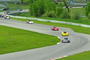 The first half of the Spec Racer Ford 3 field comes through turns 10 and 11.