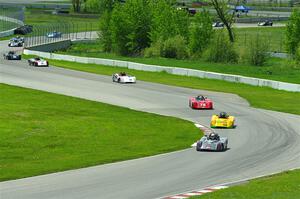 The first half of the Spec Racer Ford 3 field comes through turns 10 and 11.