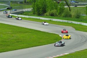 The first half of the Spec Racer Ford 3 field comes through turns 10 and 11.