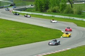 The first half of the Spec Racer Ford 3 field comes through turns 10 and 11.