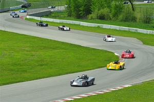 The first half of the Spec Racer Ford 3 field comes through turns 10 and 11.