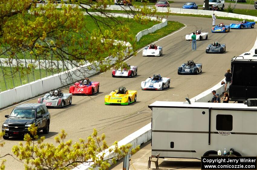 The Spec Racer Ford 3 field comes through pit lane to start the pace lap.