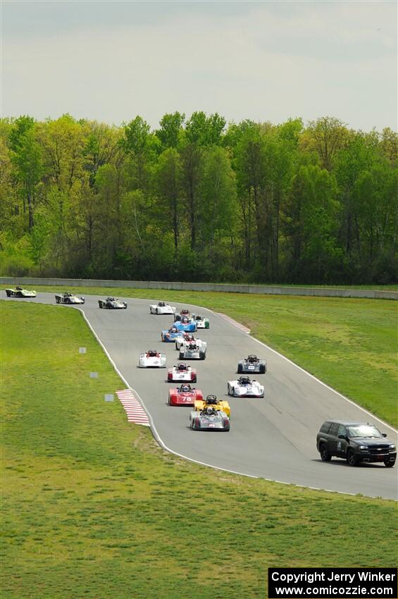 The Spec Racer Ford 3 field comes through turns 5 and 6 on the pace lap.