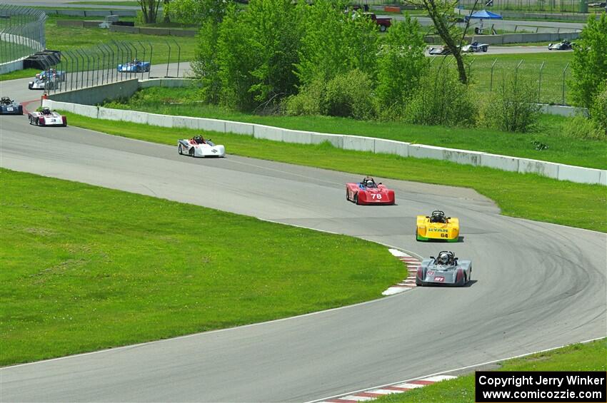 The first half of the Spec Racer Ford 3 field comes through turns 10 and 11.