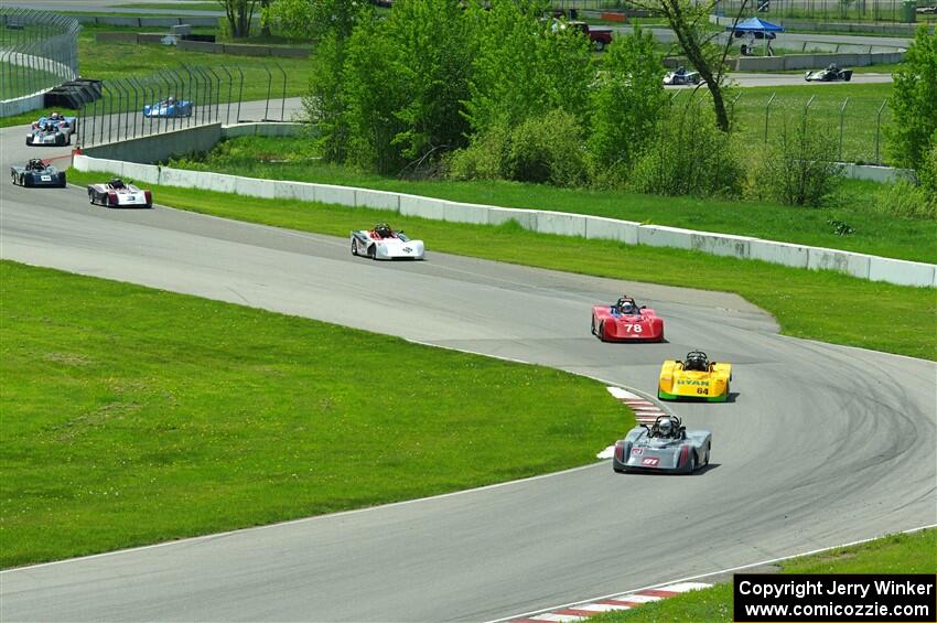 The first half of the Spec Racer Ford 3 field comes through turns 10 and 11.