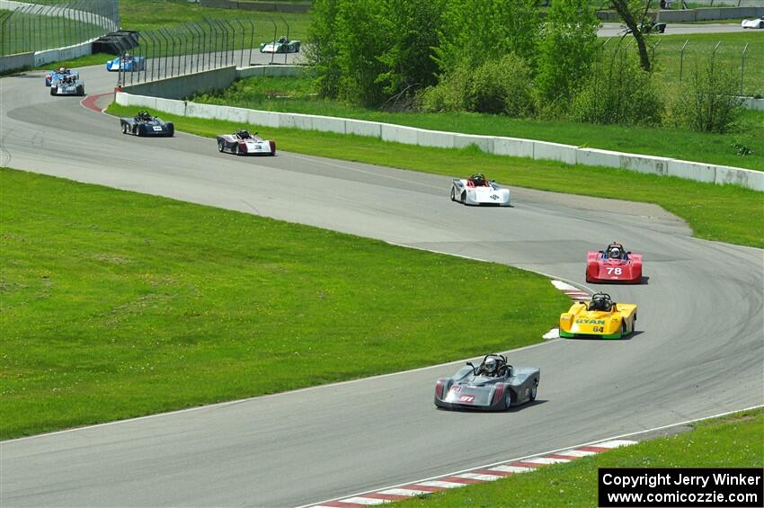 The first half of the Spec Racer Ford 3 field comes through turns 10 and 11.