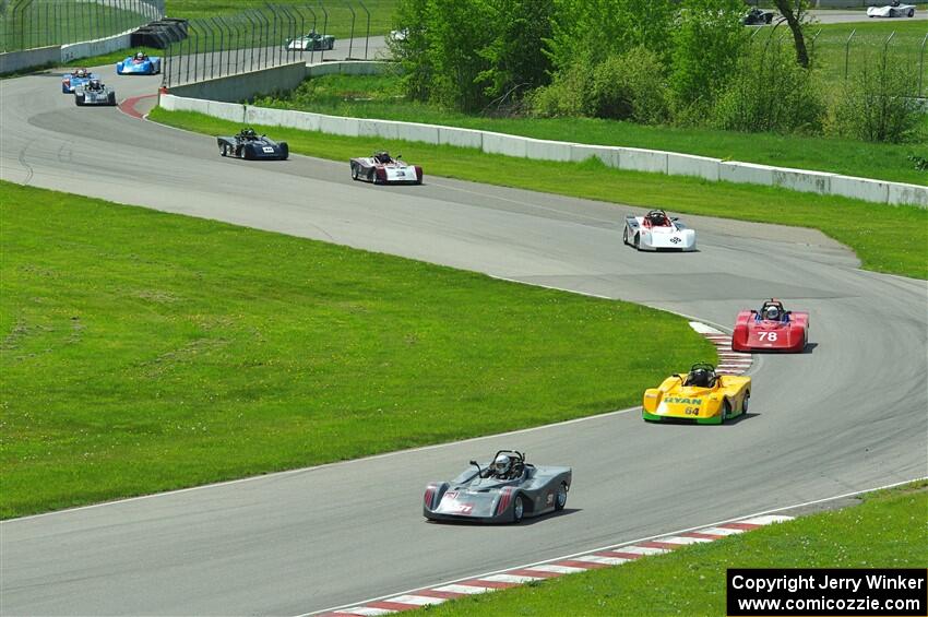 The first half of the Spec Racer Ford 3 field comes through turns 10 and 11.