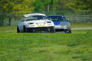 Mark Fitzpatrick's ITJ Mazda Miata and Aaron Jongbloedt's Spec Miata Mazda Miata