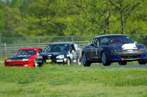 Geoff Youngdahl's Spec Miata Mazda Miata, Tom Daly's T4 VW Rabbit and Terry Orr's GTL Honda Civic