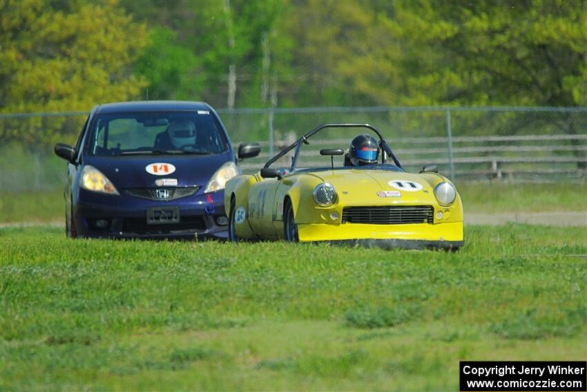 Brooke Fairbanks' H Production Triumph Spitfire and Andrew Janssen's B-Spec Honda Fit