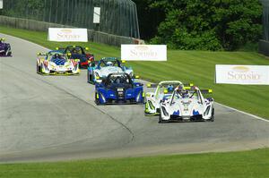 The Radical Cup field streams into turn 3 on lap one of race #1.