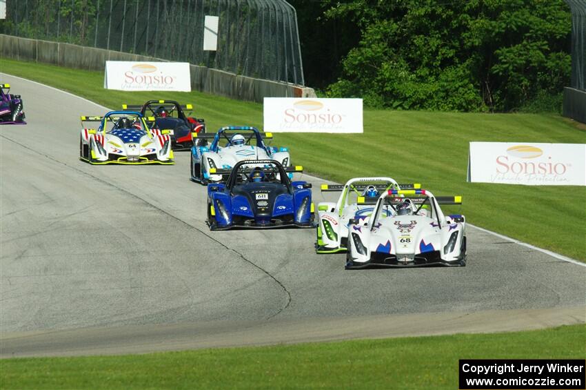 The Radical Cup field streams into turn 3 on lap one of race #1.