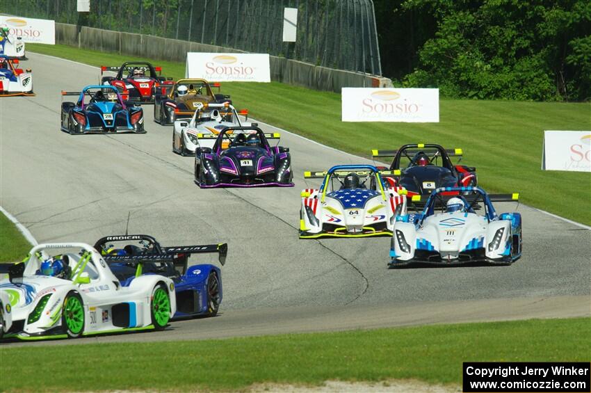 The Radical Cup field streams into turn 3 on lap one of race #1.