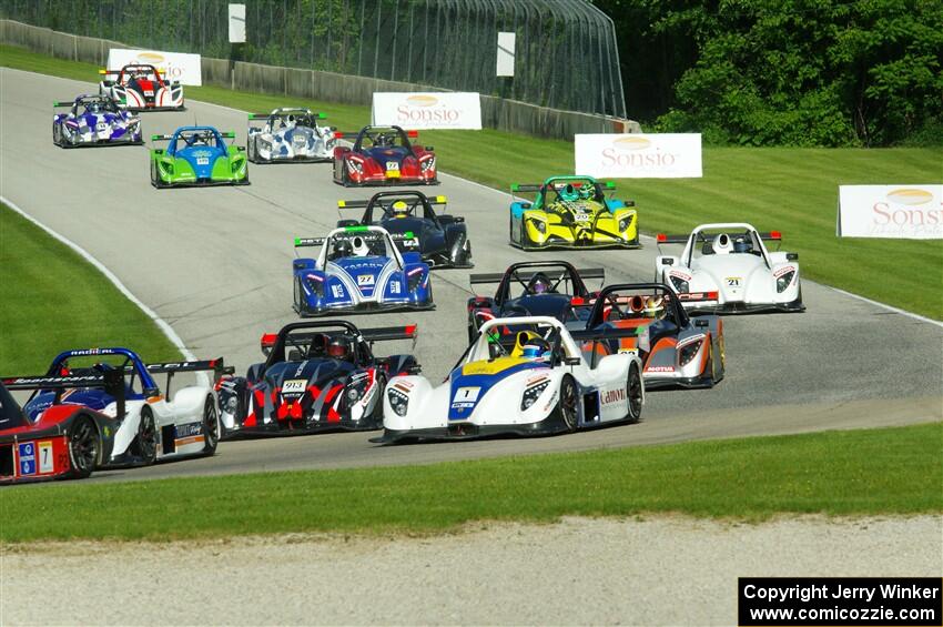 The Radical Cup field streams into turn 3 on lap one of race #1.