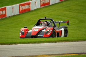 Alain Derzie's Radical SR3 RSX 1500 gets back on track at turn 14.