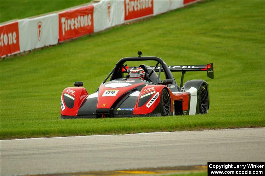 Alain Derzie's Radical SR3 RSX 1500 gets back on track at turn 14.