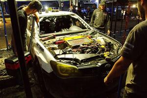 Dave Carapetyan / Adam Kneipp Subaru WRX STi gets some repairs after day one on the stages.