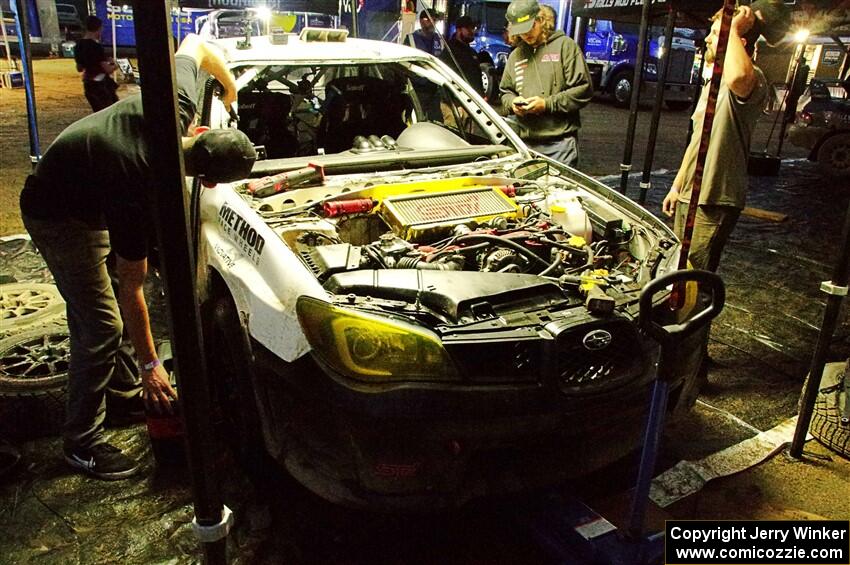 Dave Carapetyan / Adam Kneipp Subaru WRX STi gets some repairs after day one on the stages.