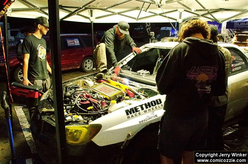 Dave Carapetyan / Adam Kneipp Subaru WRX STi gets some repairs after day one on the stages.