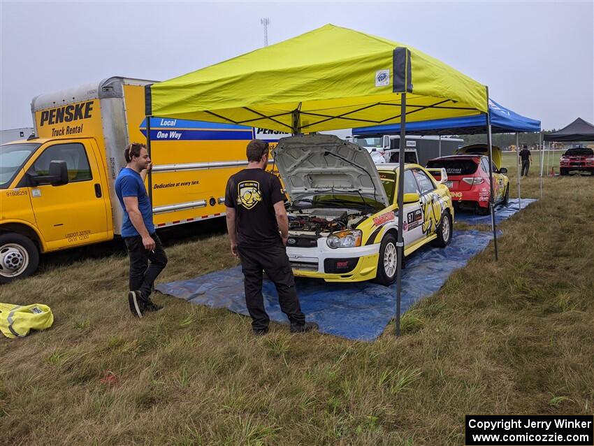 Mark Williams / Steve Harrell Subaru WRX and Scott Putnam / Spencer Putnam Subaru WRX STi prior to the start of day two stages.