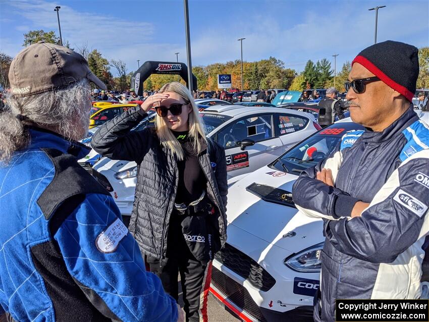 Phil Barnes, Hannah McKillop and Al Kaumeheiwa converse at parc expose.