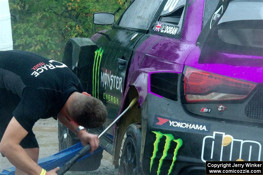 Liam Doran's Audi S1 is power-washed before the first practice.