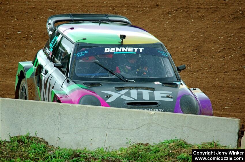 Oliver Bennett's MINI Cooper accidentally slides to a stop in turn one.