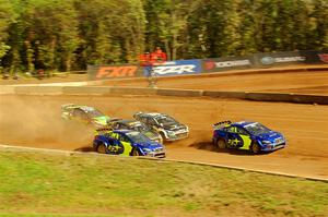 Five cars battle into the first turn during one of Sunday's heat races.