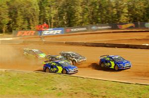 Five cars battle into the first turn during one of Sunday's heat races.