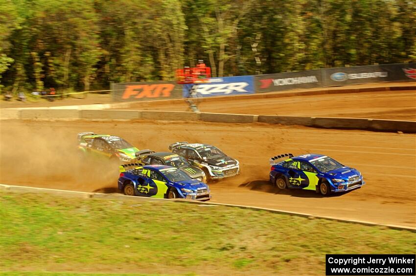 Five cars battle into the first turn during one of Sunday's heat races.