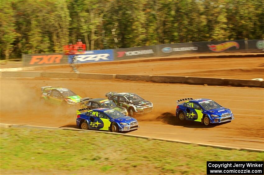 Five cars battle into the first turn during one of Sunday's heat races.