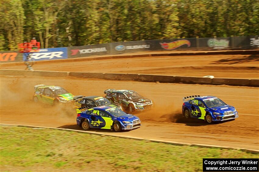 Five cars battle into the first turn during one of Sunday's heat races.