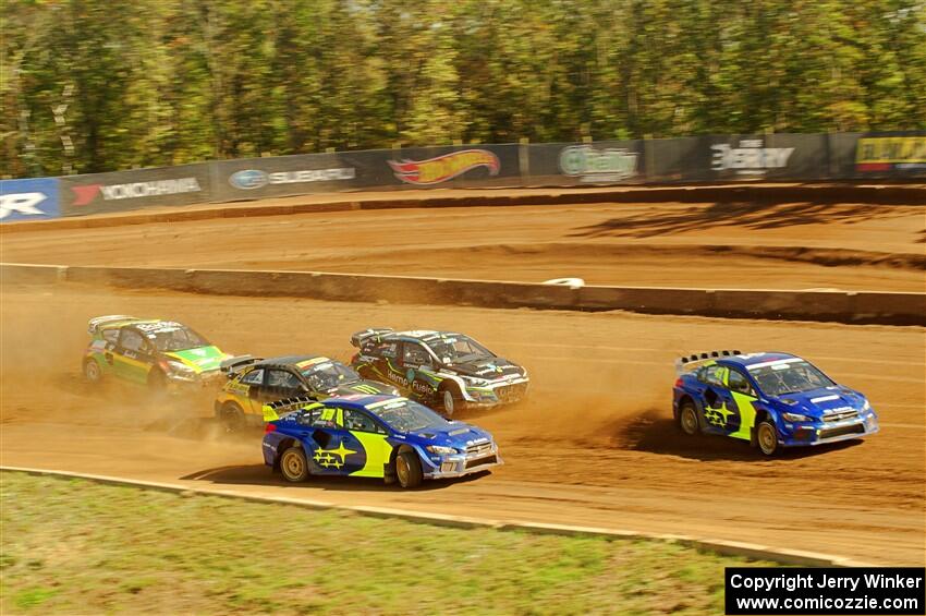 Five cars battle into the first turn during one of Sunday's heat races.