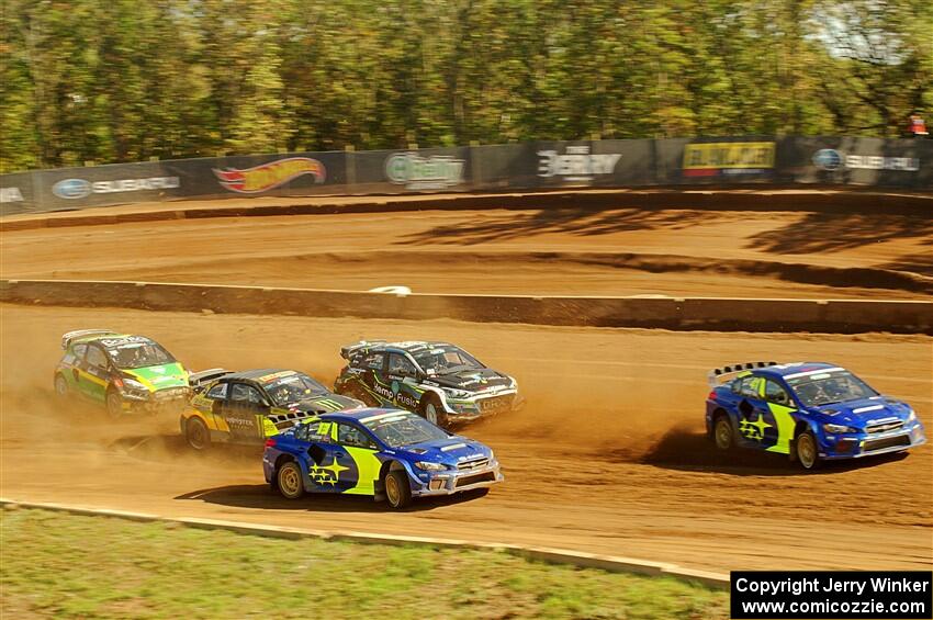 Five cars battle into the first turn during one of Sunday's heat races.