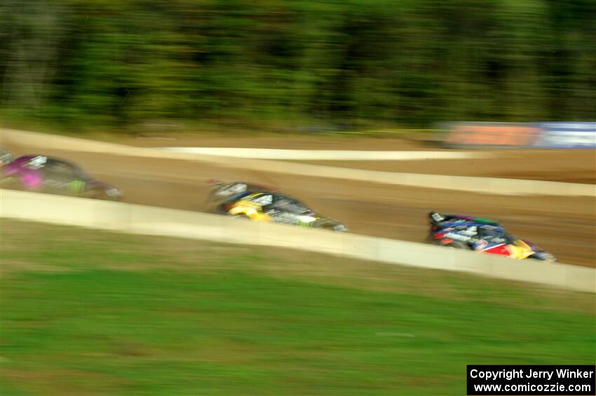 Five cars battle into the first turn during one of Sunday's heat races.