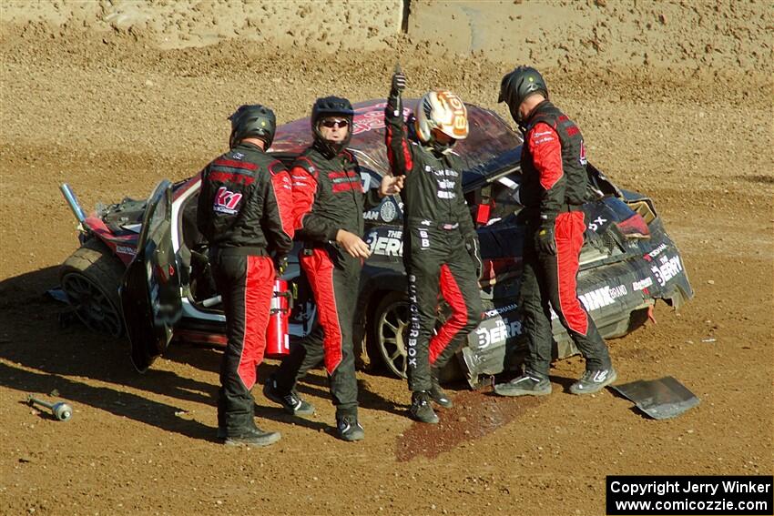 Cabot Bigham crawls from his Audi S1 and is okay.