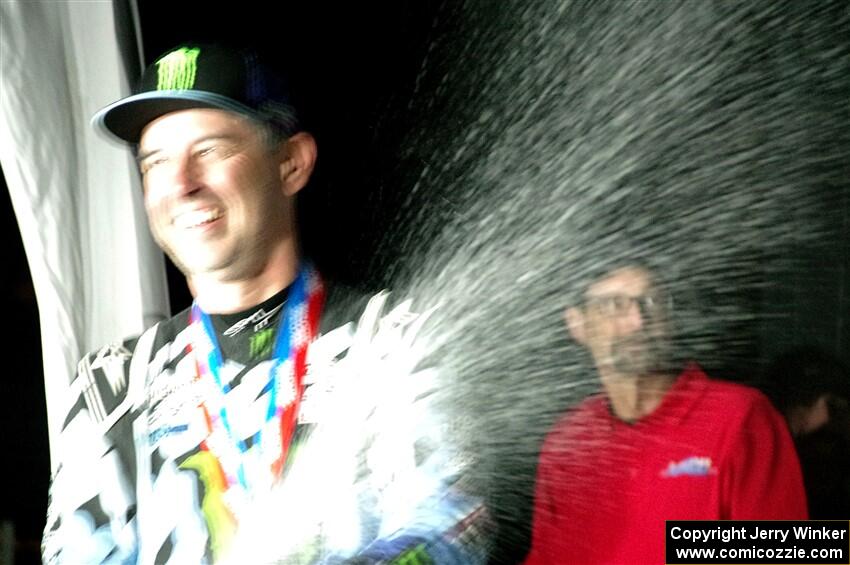 Alex Gelsomino sprays champagne after winning the event.