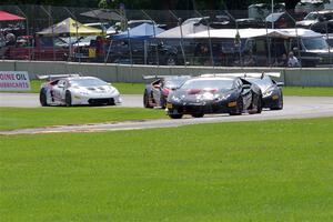 Brandon Gdovic / Todd Snyder Lamborghini Huracán LP 620-2 Super Trofeo leads a pack of cars.