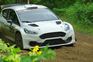 Allen Dobasu / Patrick Walsh Ford Fiesta shreds a left-front tire on SS5, Crossroads II.