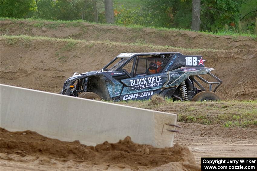 Terry Madden's Can-Am Maverick X3 snaps the front suspension and limps off the track.