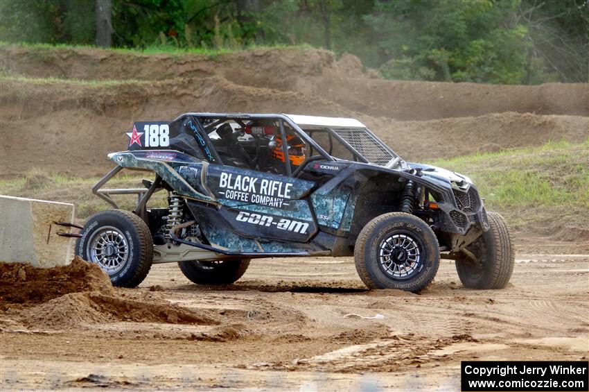 Terry Madden's Can-Am Maverick X3 snaps the front suspension and limps off the track.