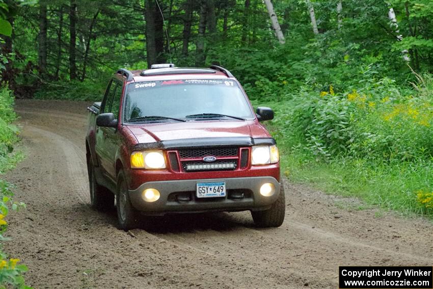 A Ford Explorer Sport Trac XLT sweeps SS5, Crossroads II.