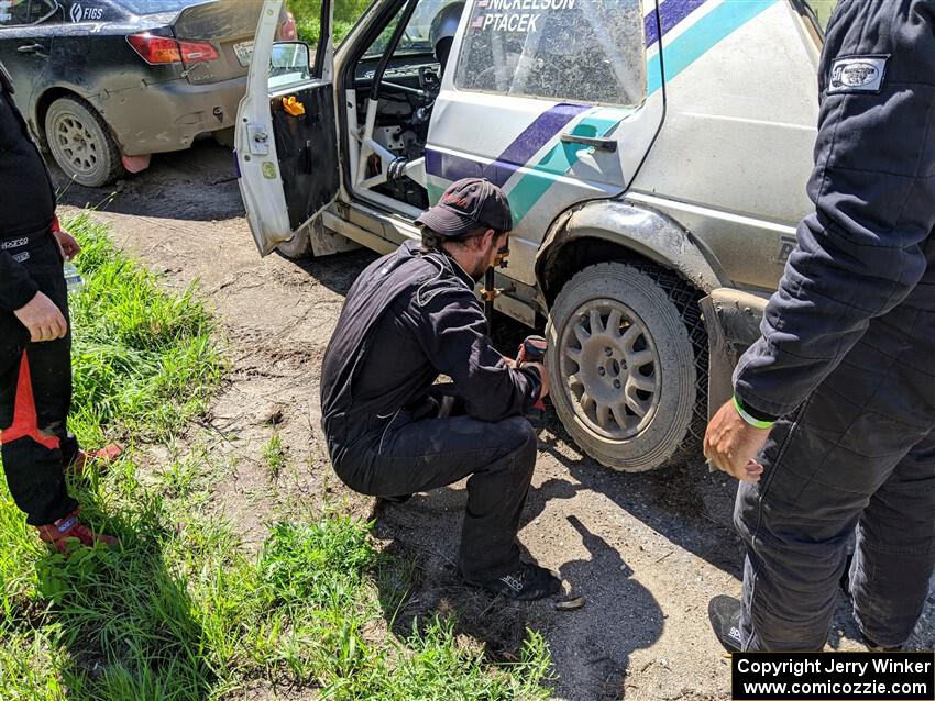 Micah Nickelson / Tyler Ptacek VW Golf change a tire prior to SS12, Height o' Land II.