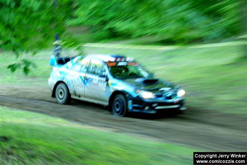 Matt James / Jackie James Subaru Impreza limps through SS16, Soo Pass East II, with a right-front flat.