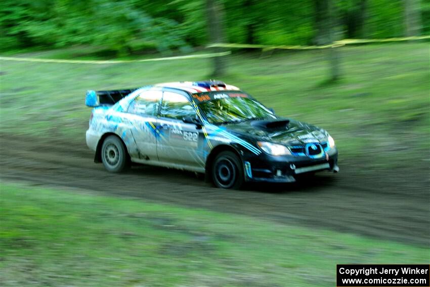 Matt James / Jackie James Subaru Impreza limps through SS16, Soo Pass East II, with a right-front flat.