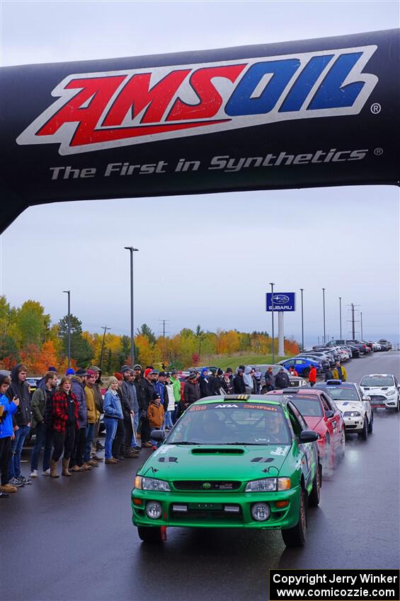 Jordan Locher / Tom Addison Subaru Impreza 2.5RS leaves the ceremonial start.