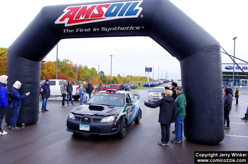 Matt James / Jackie James Subaru Impreza leaves the ceremonial start.