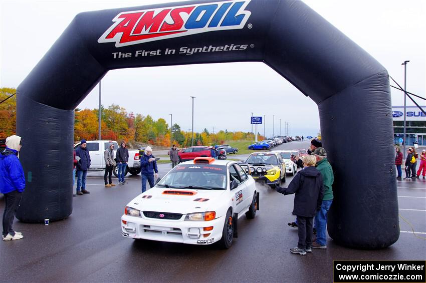 Richard Donovan / Greg Donovan Subaru Impreza leaves the ceremonial start.